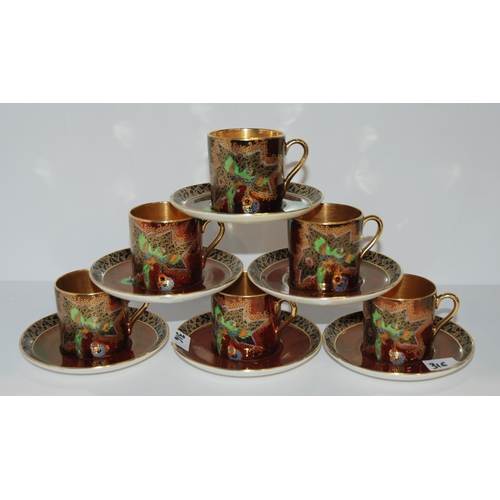 316 - A Crown Devon coffee set, pattern number 2114, decorated with a parrot...