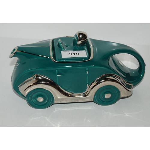 319 - A Sadler OKT42 racing car teapot in teal green glaze...