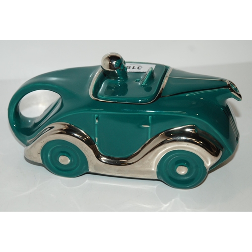 319 - A Sadler OKT42 racing car teapot in teal green glaze...