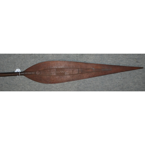 467 - A Polynesian spear and a carved tribal mask (2)...