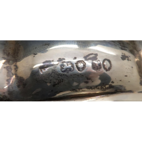 894 - A William IV silver wine coaster, London 1836 (makers mark rubbed) with a rococo style scrolling bor...