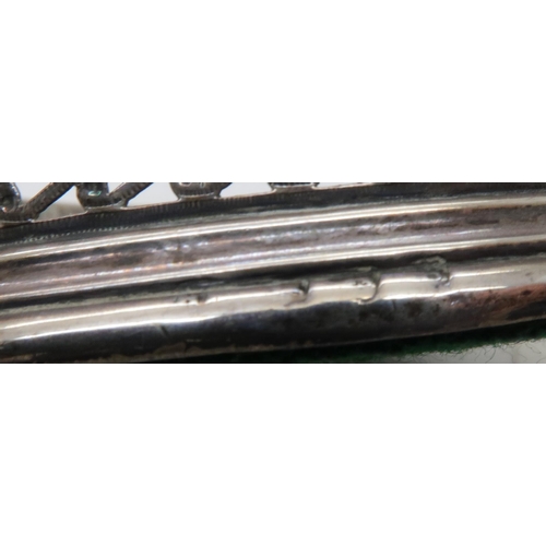 894 - A William IV silver wine coaster, London 1836 (makers mark rubbed) with a rococo style scrolling bor...