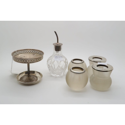 895 - A collection of four glass and silver topped match strikers, London 1900, makers marks mostly rubbed...