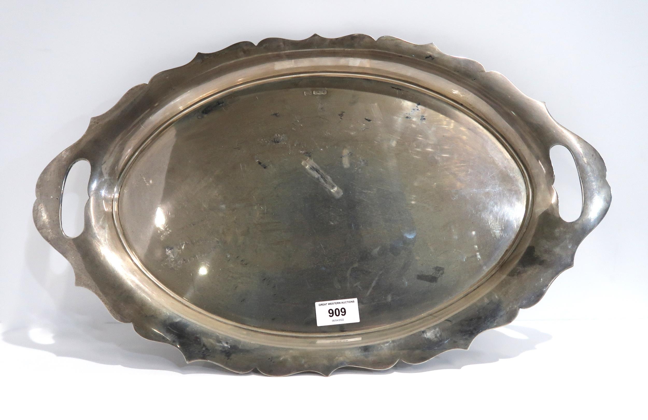 A large twin handled silver tray with pie crust rim, Walker ...