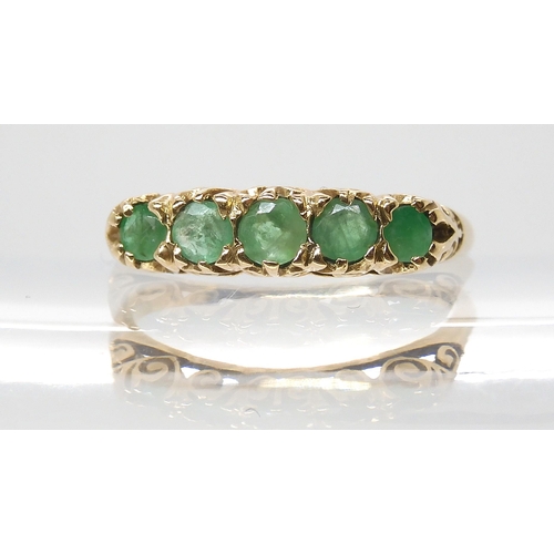 674 - A 9ct gold five emerald ring with classic scrolled mount, size P, weight 2gms...