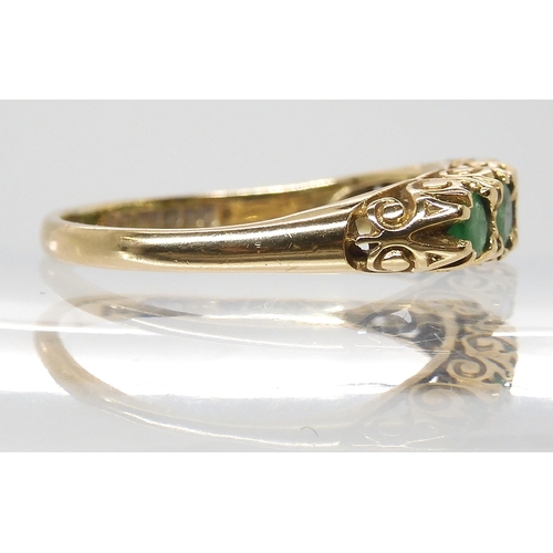 674 - A 9ct gold five emerald ring with classic scrolled mount, size P, weight 2gms...