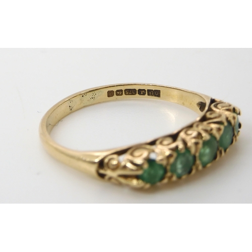 674 - A 9ct gold five emerald ring with classic scrolled mount, size P, weight 2gms...
