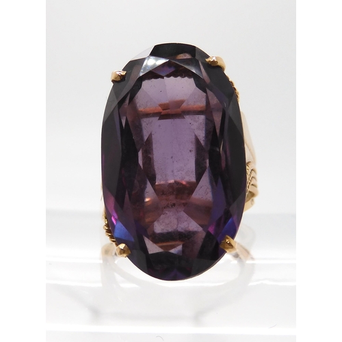 676 - A 14k gold colour change faux amethyst ring, finger size O, weight 11.7gms...