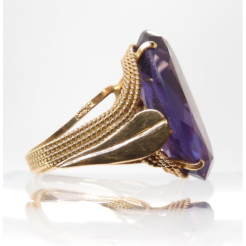 676 - A 14k gold colour change faux amethyst ring, finger size O, weight 11.7gms...