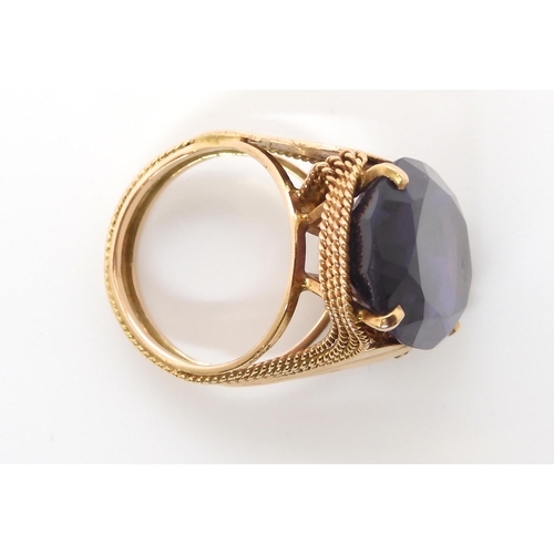 676 - A 14k gold colour change faux amethyst ring, finger size O, weight 11.7gms...
