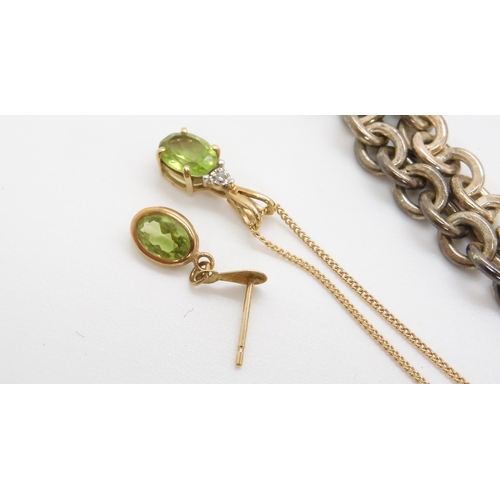710 - A 9ct gold peridot and diamond accent pendant and one matching earring, weight 2gms, together with a...