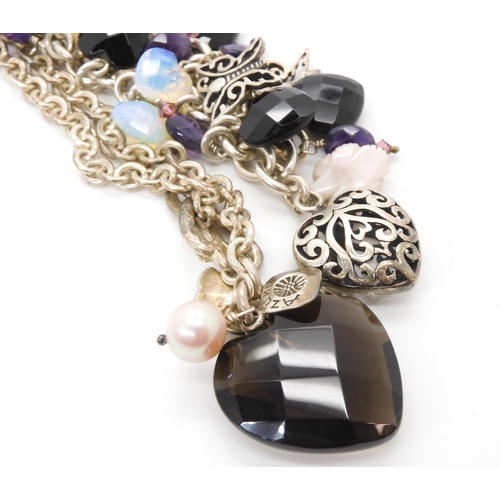 710 - A 9ct gold peridot and diamond accent pendant and one matching earring, weight 2gms, together with a...