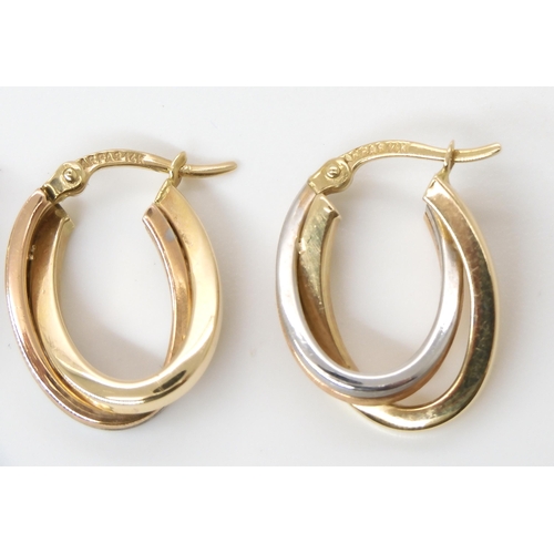 711 - A pair of three colour 14k gold earrings weight 2.5gms and a 9ct gold blue and green gem set ring si...