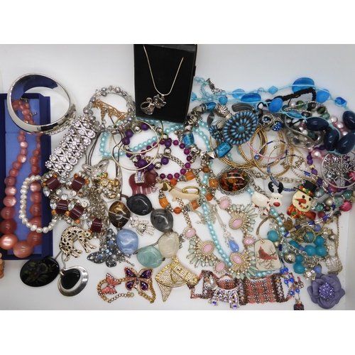 787 - A collection of costume jewellery to include items by Kirks Folly and Butler & Wilson...