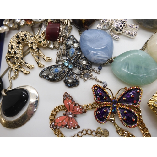 787 - A collection of costume jewellery to include items by Kirks Folly and Butler & Wilson...