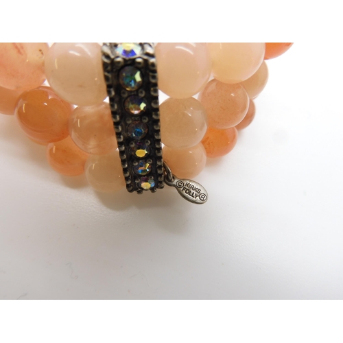 787 - A collection of costume jewellery to include items by Kirks Folly and Butler & Wilson...