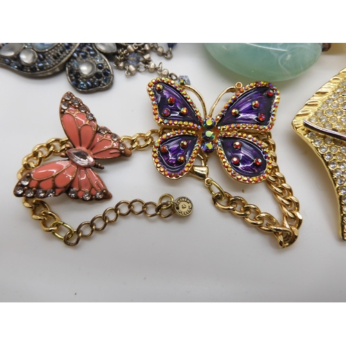 787 - A collection of costume jewellery to include items by Kirks Folly and Butler & Wilson...