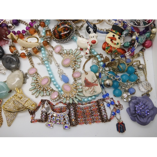 787 - A collection of costume jewellery to include items by Kirks Folly and Butler & Wilson...