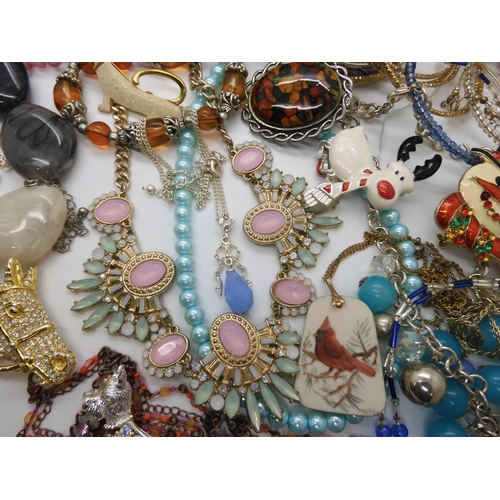 787 - A collection of costume jewellery to include items by Kirks Folly and Butler & Wilson...
