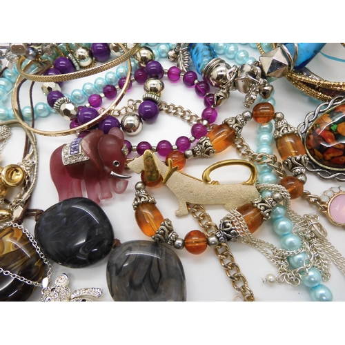 787 - A collection of costume jewellery to include items by Kirks Folly and Butler & Wilson...
