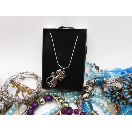 787 - A collection of costume jewellery to include items by Kirks Folly and Butler & Wilson...