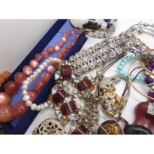 787 - A collection of costume jewellery to include items by Kirks Folly and Butler & Wilson...