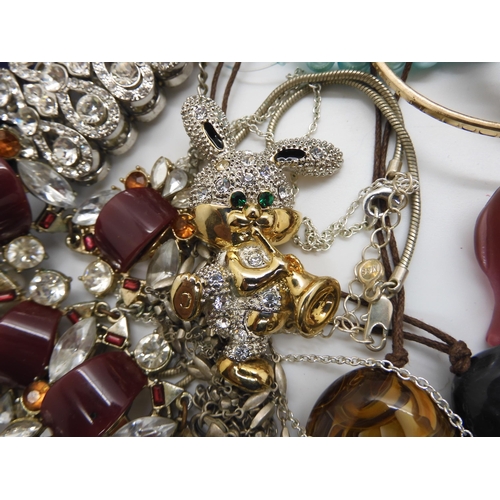 787 - A collection of costume jewellery to include items by Kirks Folly and Butler & Wilson...
