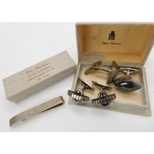 822 - A pair of Danish silver cufflinks by Hans Hansen, a further pair by John Markusen and a Danish silve...