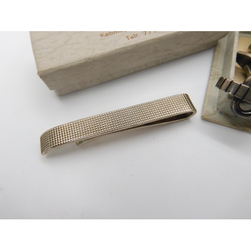 822 - A pair of Danish silver cufflinks by Hans Hansen, a further pair by John Markusen and a Danish silve...