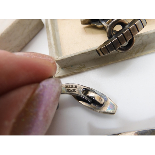 822 - A pair of Danish silver cufflinks by Hans Hansen, a further pair by John Markusen and a Danish silve...