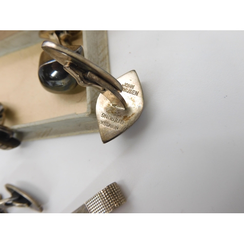 822 - A pair of Danish silver cufflinks by Hans Hansen, a further pair by John Markusen and a Danish silve...