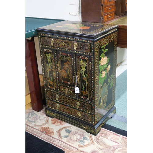 2 - A 20th century oriental black lacquer and floral painted cabinet