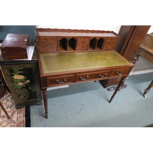 3 - A 20th reproduction mahogany writing desk with green skiver on turned supports