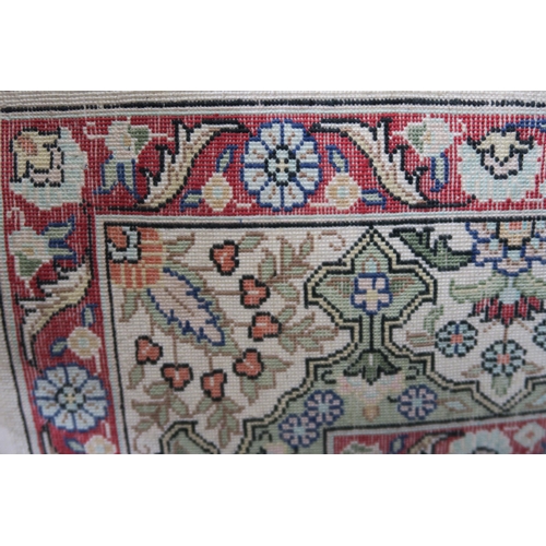 41 - A cream ground tree of life prayer rug with extensive floral and foliate details, 91cm long x 62cm w... 