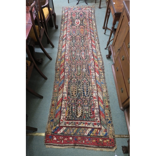 60 - A multicoloured Caucasian runner with allover design and multiple borders, 334cm long x 91cm wide