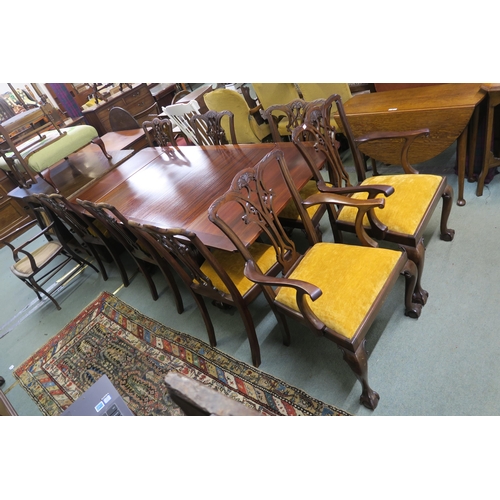 61 - A 20th century mahogany dining suite consisting  extending dining table on carved claw and ball supp... 