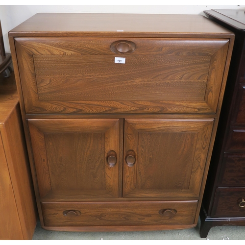 101 - A mid 20th century elm and beach Ercol Windsor cocktail/serving cabinet model 469 with fall front ab... 