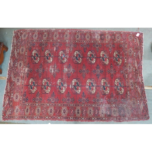 63 - A red ground Bokhara rug, 181cm long x 123cm wide 