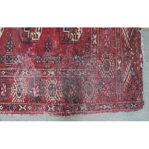 63 - A red ground Bokhara rug, 181cm long x 123cm wide 