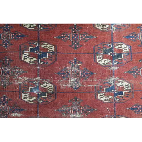 63 - A red ground Bokhara rug, 181cm long x 123cm wide 