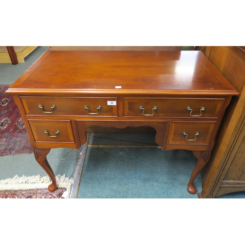 65 - A 20th century mahogany writing desk on cabriole supports, 77cm high x 98cm wide x 52cm deep