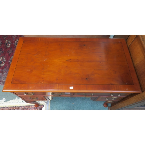 65 - A 20th century mahogany writing desk on cabriole supports, 77cm high x 98cm wide x 52cm deep