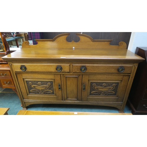 66 - An early 20th century oak arts and crafts sideboard with two doors above two cabinet doors, 123cm hi... 