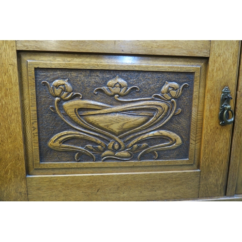 66 - An early 20th century oak arts and crafts sideboard with two doors above two cabinet doors, 123cm hi... 