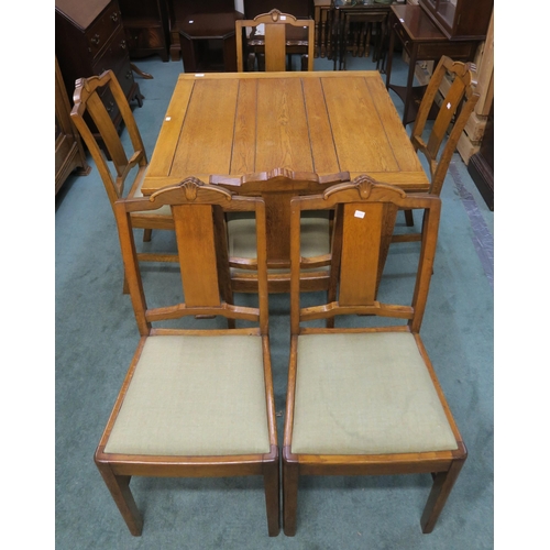 67 - An early 20th century oak pull out dining table and six chairs (7)