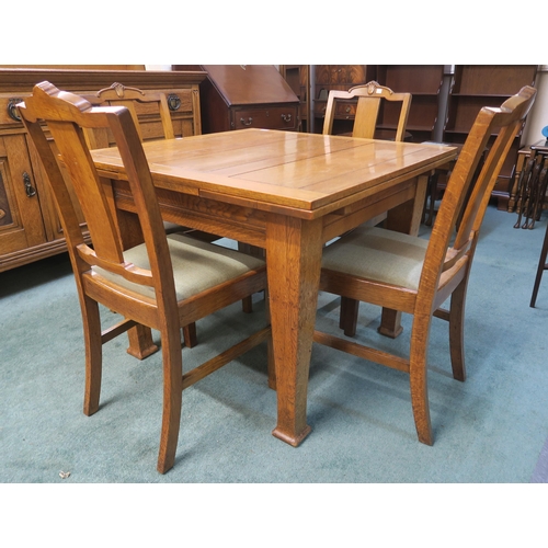 67 - An early 20th century oak pull out dining table and six chairs (7)