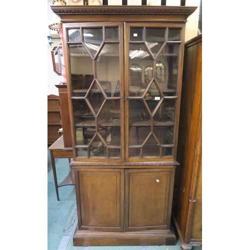 75 - A Victorian mahogany glazed bookcase with two astragal glazed doors above two cabinet doors, 194cm h... 