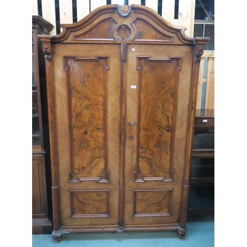 76 - A Victorian burr walnut two door continental style wardrobe, 200cm high x 124cm wide x 54cm deep