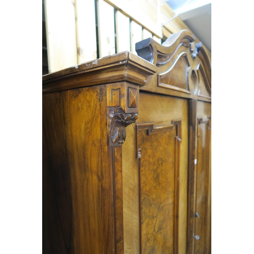 76 - A Victorian burr walnut two door continental style wardrobe, 200cm high x 124cm wide x 54cm deep