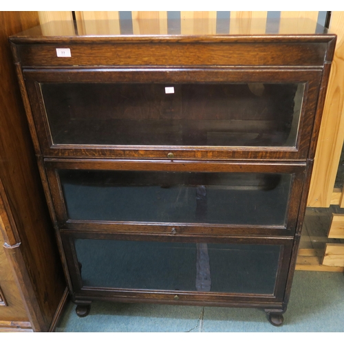 77 - An early 20th century oak three tier sectional bookcase, 113cm high x 87cm wide x 31cm deep